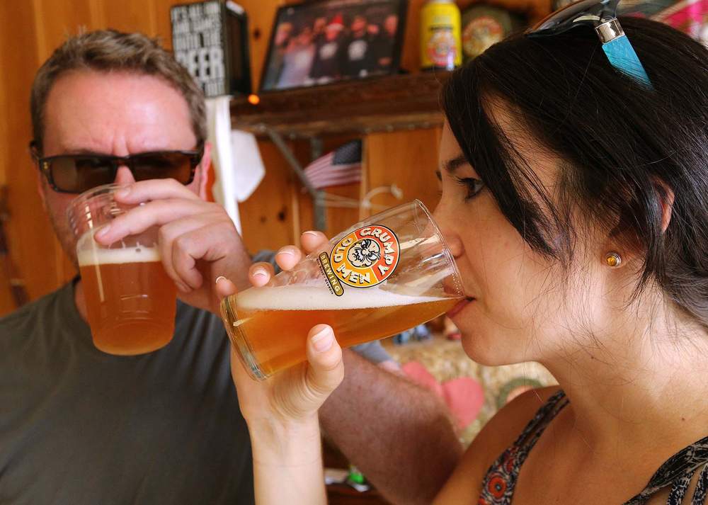 Steve Cieslik and Alexis Gayhart, from Pittsburgh, try their first beer during a tour at Blue Ridge’s Grumpy Old Men Brewing in July. 