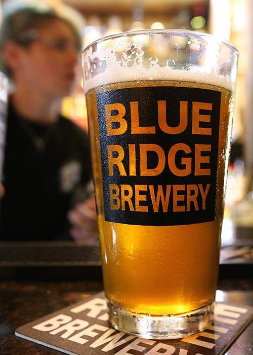 A draft IPA sits on the bar at Blue Ridge Brewery. The brewpub devotes six taps to its own beer and seven to outside breweries.