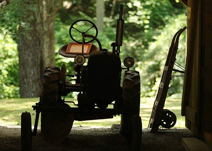 The 1947 Farmall Cub tractor owned and used by Reece sits in the main barn at the Byron Herbert Reece Farm &amp;amp; Heritage Center.    Curtis Compton\/AJC