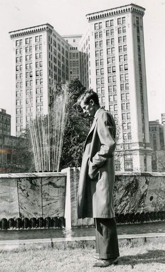 The poet pauses beside the fountain in Hurt Park in Atlanta in the 1950s. AJC file