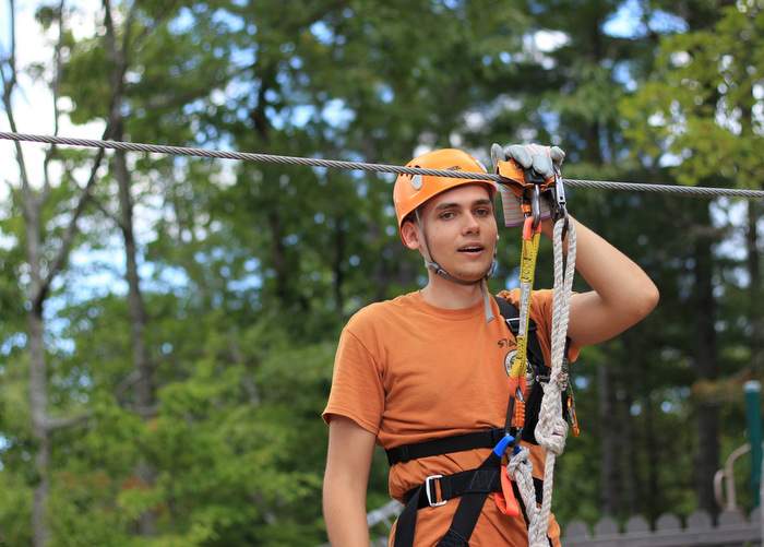 Tristan Carroll, zip line guide, explains safety procedures before a tour at the Unicoi Aerial Adventure Park’s zip line facility. Contributed by Lane Pratt