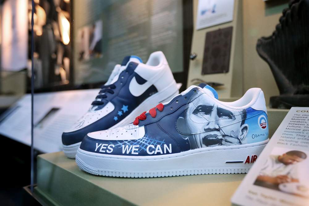 Sneakers with the hand-painted images of President Barack Obama by artist Van Taylor Monroe are on display.  (Chip Somodevilla\/Getty Images)