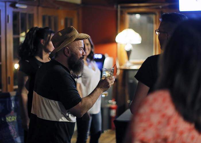 After Angie performed at Eddie's Attic in Decatur, he toasted the group saying he was happy to be able to have a drink again. 