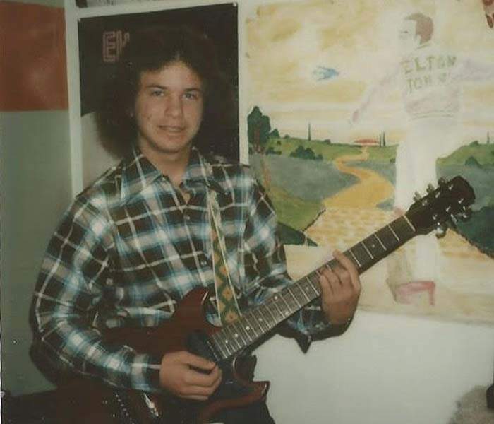 Angie in 1978, in front of picture he painted of Elton John. Contributed