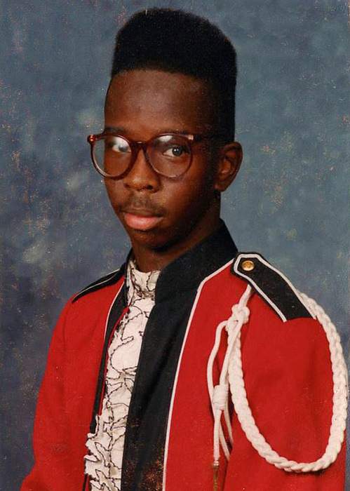 Fahamu Pecou, 16, in his marching band photograph taken in 1991 in South Carolina. He played the trombone. PHOTO COURTESY OF PECOU FAMILY.