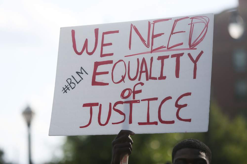 Protesters marched from the Center for Civil and Human Rights on Ivan Allen Jr. Boulevard to the CNN Center on Marietta Street on July 8, 2016, in response to recent shootings and civil rights issues. The rally and march were planned by Silent Majority, a group of five local teens, and the NAACP.PHOTO: Emily Jenkins \/ AJC