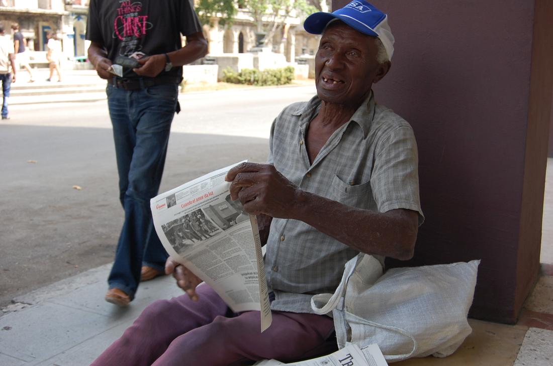 A man sells newspapers on the Havana streets.Photo: Katie Leslie / kleslie@ajc.com