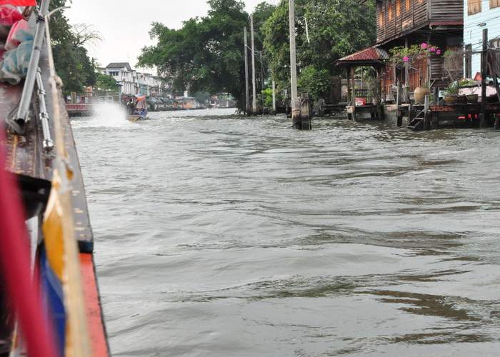 Long-tail boat tour along the river canals of Bangkok, Thailand. Photo by Michael Yetter