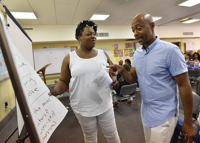 Craig Washington and Tori Cooper (left) during "A Weekend Summit For HIV+ Long Term Survivors" in July.
