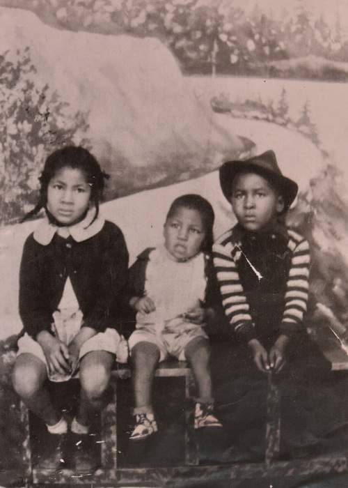 Walter Banks (center) is pictured in a family photo with his brother and sister. The siblings grew up in Summerhill.  Contributed
