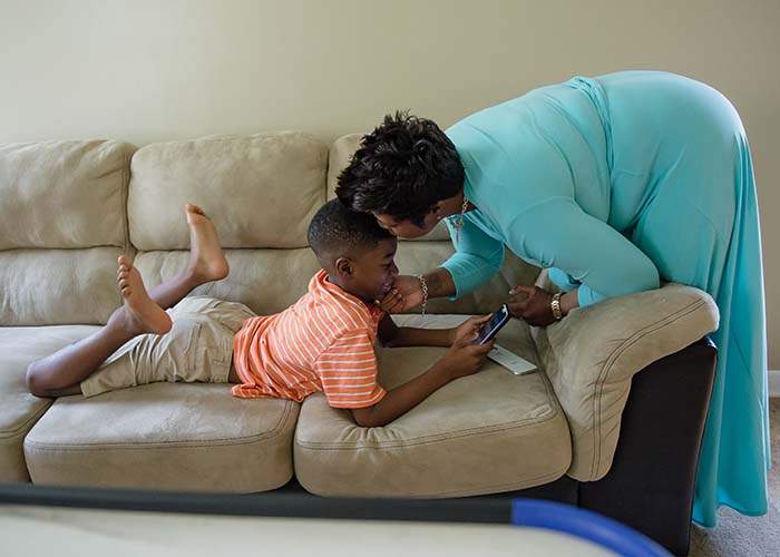 Dorsey gives son Alston Cook a kiss.