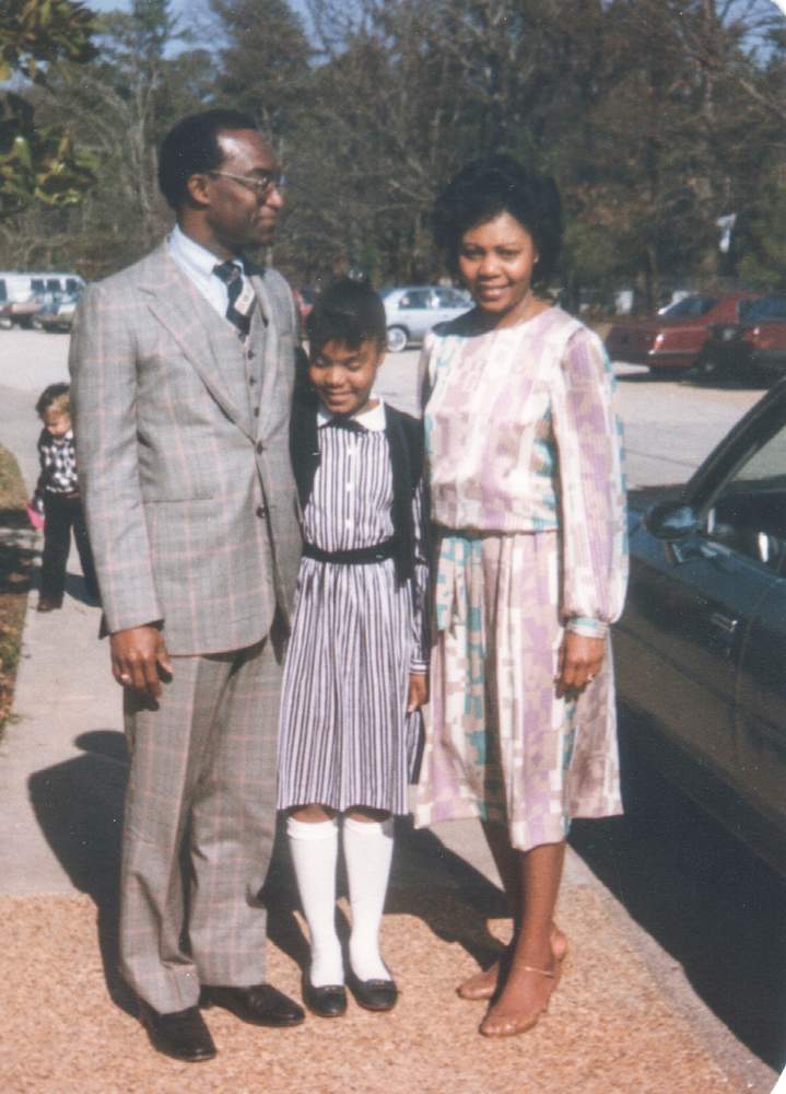 Nicki (center) with her father and mother. Contributed photo