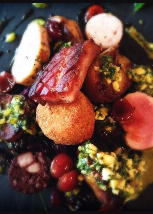 The Charcroute, a family-style dish served at Cure in Pittsburgh's foodie Lawrenceville neighborhood, includes six types of meat such as boudin blanc, pork tenderloin, and trotter croquette.  Washington Post