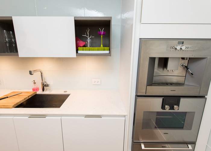 The Kao family kitchen, designed by RAO Design Studio, is open and spacious thanks to removing walls and adding glass.