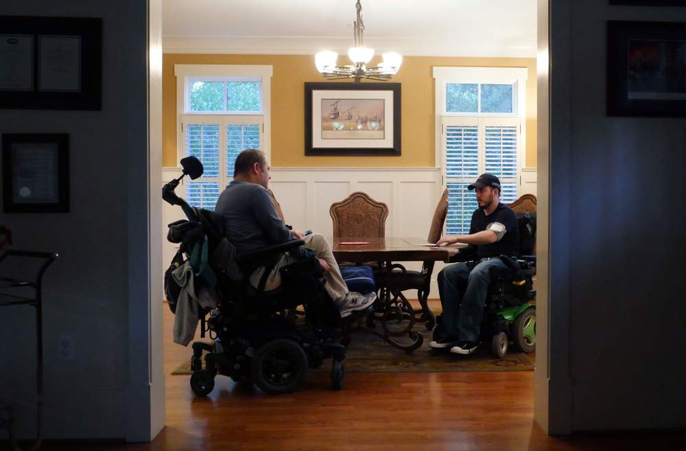 Ignacio and Ross talk at home. Photo by Hyosub Shin \/ hshin@ajc.com