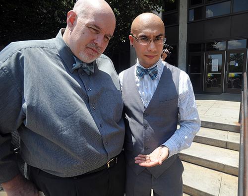 Darrell Gosnell (left),  of Scottsdale,  and his partner and soon to be husband,  Andrew Wise,  talk with the media outside the DeKalb County Courthouse Friday. (KENT D. JOHNSON \/ KDJOHNSON@AJC.COM)