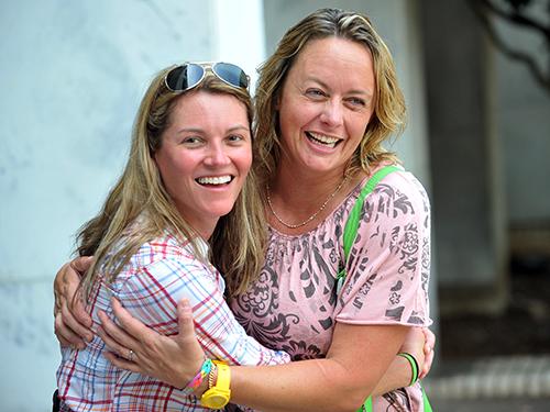 Annie Dollarhide (left) of Decatur and her new wife,  Sylvia O'Connell,  celebrate following their marriage ceremony outside the DeKalb County Courthouse. (KENT D. JOHNSON \/ KDJOHNSON@AJC.COM)