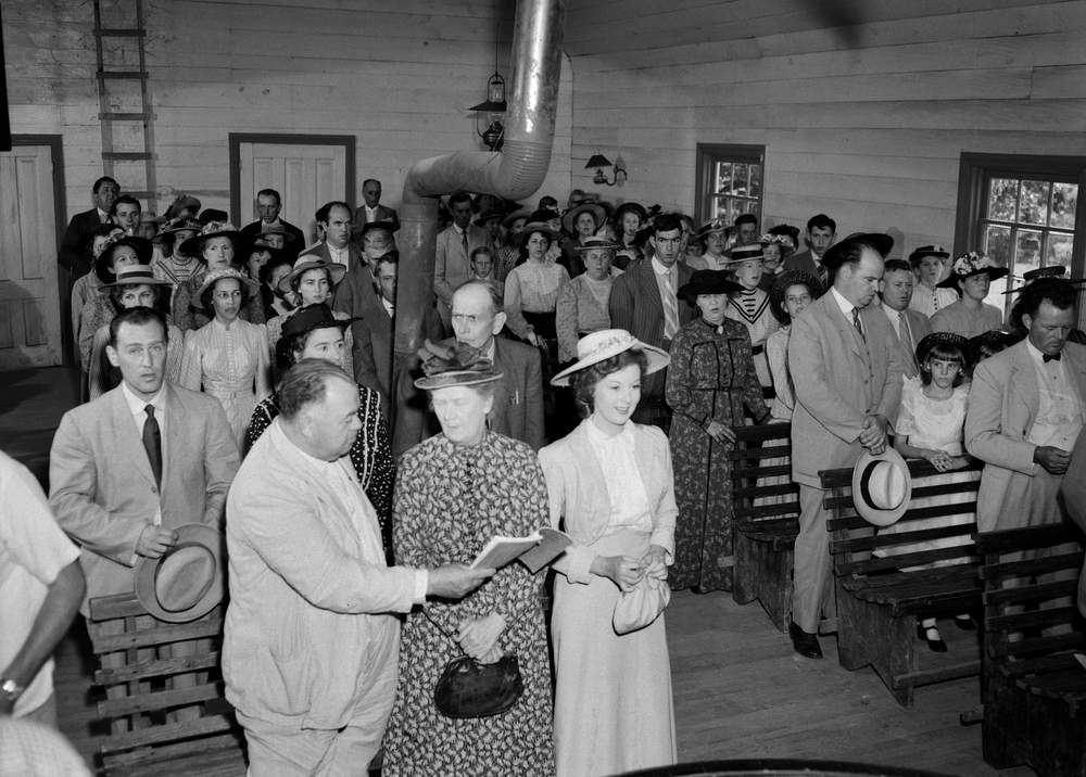 Actress Susan Hayward (woman on right, first row) and other cast members during the filming of "I'd Climb the Highest Mountain" in Helen, Ga., in 1951. Kenneth Rogers\/AJC, photo courtesy of the Kenan Research Center at the Atlanta History Center.
