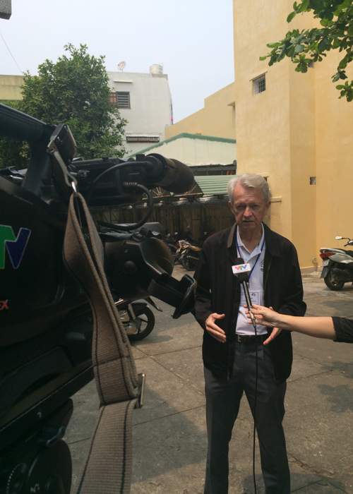Searcy is interviewed on Vietnamese television after meeting with local government officials.