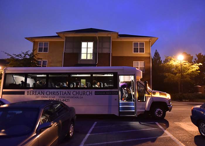 Children and Foreverfamily staff board a bus outside Foreverfamily Atlanta early Saturday morning,  August 13,  2016 before driving 2 1\/2 hours to the Pulaski State Prison in Hawkinsville. (Hyosub Shin \/ hshin@ajc.com)