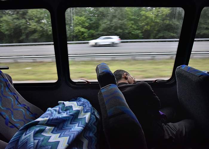 Children catch some sleep during the 2 1\/2 hour bus ride to the Pulaski State Prison to meet their mothers on an early Saturday morning. (Hyosub Shin \/ hshin@ajc.com)