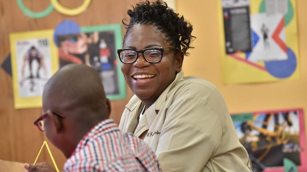 Shakiethia Wheeler shares a laugh with her son in the Children's Center at the Pulaski State Prison. (Hyosub Shin \/ hshin@ajc.com)