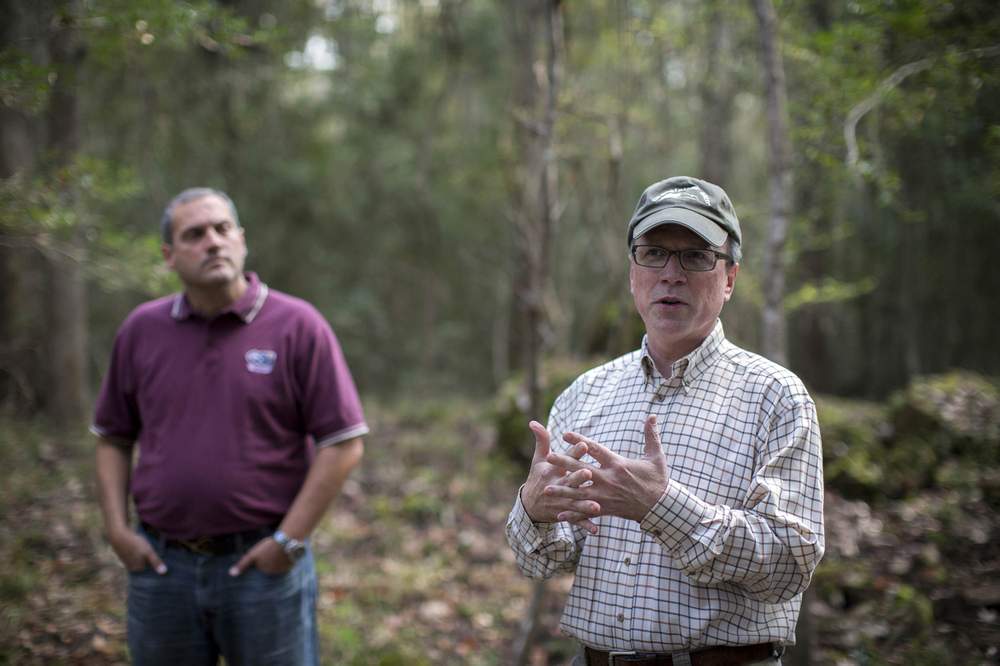 Todd Groce,  right,  president of the Georgia Historical Society,  and Solomon Smith,  left,  Assistant Professor of History at Georgia Southern University, think Mulberry Grove should be preserved as a reminder of its past. (Stephen B. Morton\/AJC)
