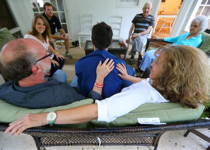 At a family gathering in their Johns Creek home, Jeff and Jeanne Schultz have Josh’s back. From left is their daughter Sierra, her fiancee Jake Burgdorf and Jeanne’s parents Bill and Agnes Makatura. Curtis Compton \/ ccompton@ajc.com