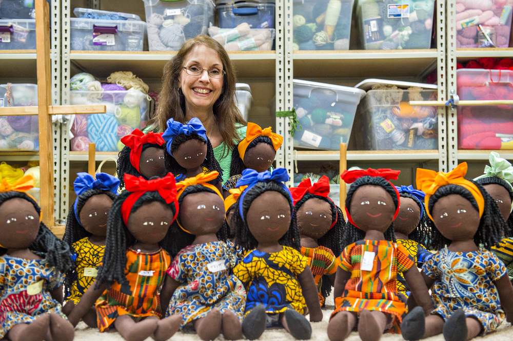Cathy Palmer with a batch of Refugee Friend Dolls at the Refugee Sewing Society in Clarkston. Photos by Hyosub Shin \/ hshin@ajc.com