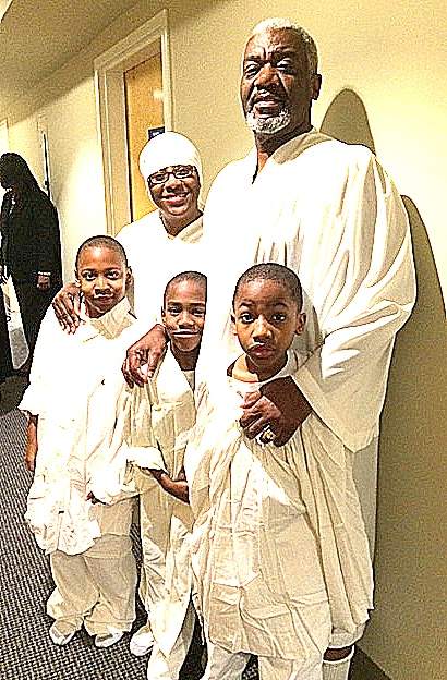 Pam and Michael Majette with their sons (from left) Michael Jr., Mariyo and Markus, before baptism at Mount Vernon Baptist Church on Dec. 4. Contributed by Michael Majette