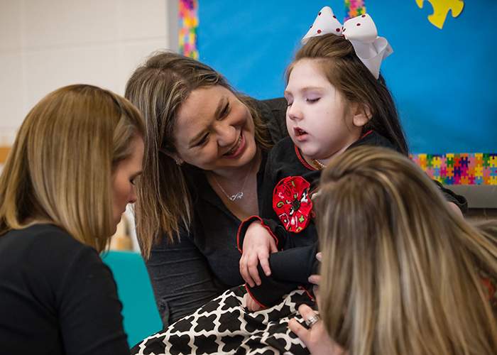 Haleigh Cox receives physical therapy while her mom, Janea Cox, assists. Contributed by Bita Honarvar