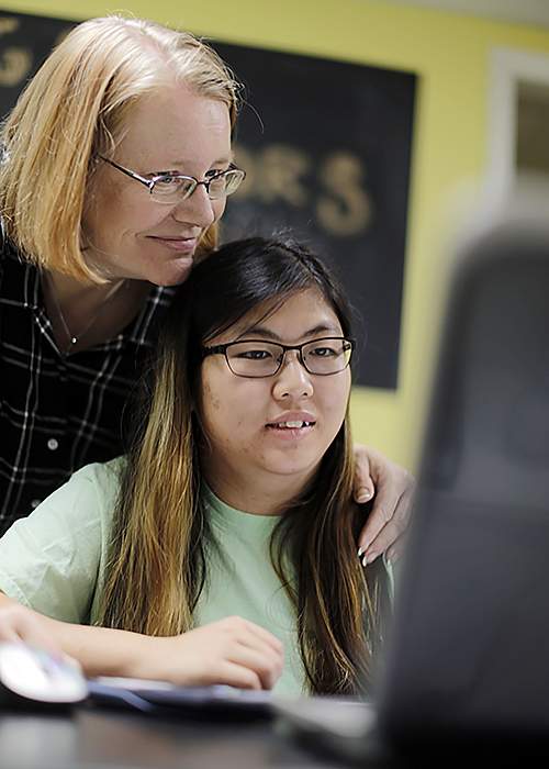 Julie Beem looks at one of Libby’s online assignments. Julie and her husband, David, refused to send their daughter to a psychoeducational program.