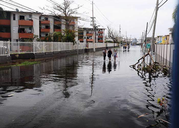 Puerto Rican residents walk in flooded streets in Condado, San Juan, Puerto Rico, on Sept. 22, 2017, following Hurricane Maria. Puerto Rico National Guard photo by Sgt. Jose Ahiram Diaz-Ramos