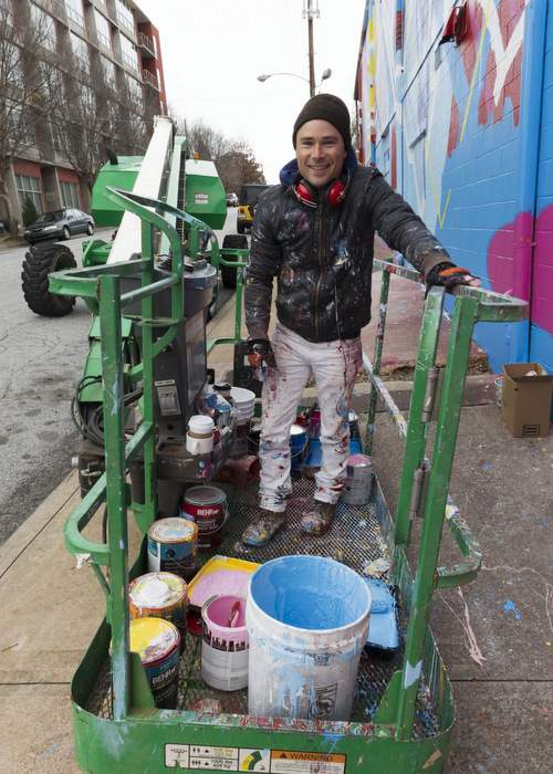 At work on a full-building mural for the Westside Cultural Arts Center in Midtown in 2012. Photo: Steve Cole