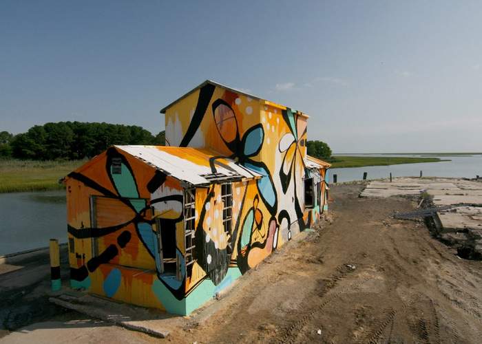 Alex Brewer wrapped his first building, an abandoned factory in Oyster, Va., in 2010. Photo: HENSE