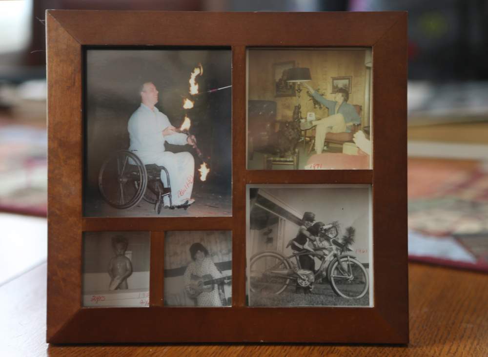 A frame of family photos documents Frank Barham's life.  Ben Gray \/ bgray@ajc.com