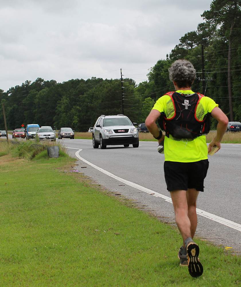Atlanta Journal-Constitution photographer Ben Gray runs in memory of friend and musician Frank Barham,  who was killed on Savannah Highway in Screven County a year before. Ryon Horne \/ rhorne@ajc.com