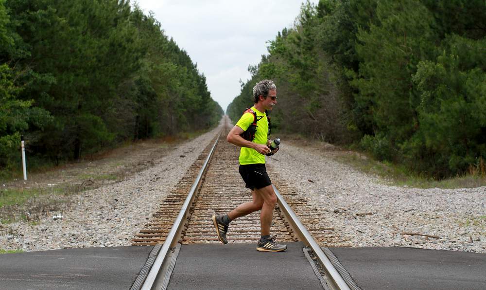 Atlanta Journal-Constitution photographer Ben Gray runs in memory of friend and musician Frank Barham,  who was killed on Savannah Highway in Screven County a year before. Ryon Horne \/ rhorne@ajc.com