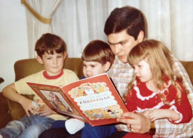 Jackson reads to his kids at Christmastime in the early 1980s. Family photo.