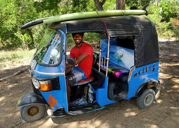 Surfing instructor Jacob Siril transports his surf-board to Peanut Farm, a surf-spot outside Arugam Bay in Sri Lanka, on the roof of his tuk-tuk. Photo for The Washington Post by Henry Wismayer.