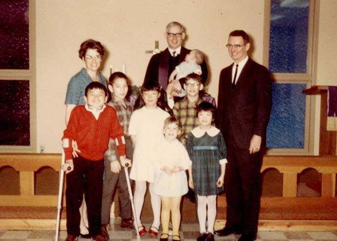 Steve Stirling at church with his adoptive family in the United States.