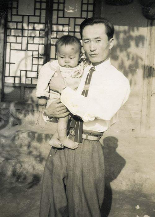 Steve, around the age he contracted polio, with his father in South Korea. Contributed by Steve Stirling