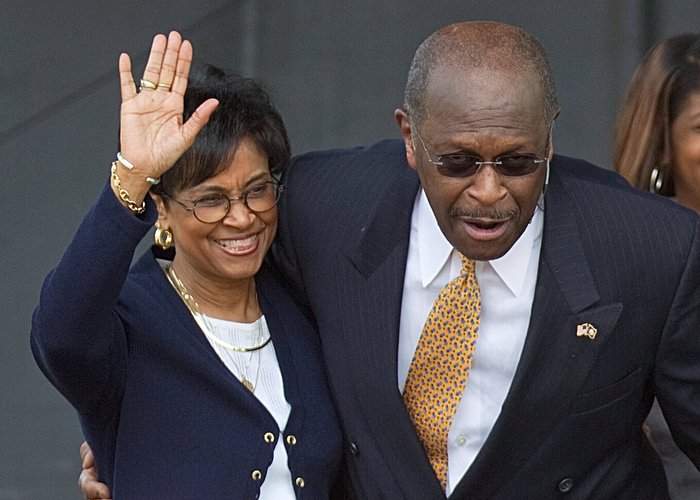 Gloria Cain (left) joins her husband, Herman Cain, four years ago on the campaign trail. “I focus first and foremost on being Christian and try not to look at labels politically,” she said. “I look at people, what they stand for and if their principles align with mine.” David Goldman\/AP