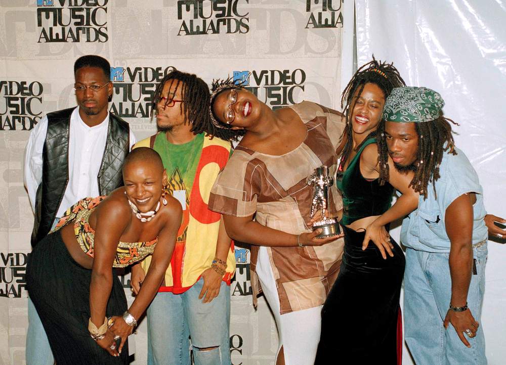 Hip-hop group Arrested Development pose with their award for best rap video for their song People Everyday at the 1993 MTV Video Music Awards. The members included (from left): Headliner, Eshe, Speech, Taree, Taree, Nadirah and Rasa Don.