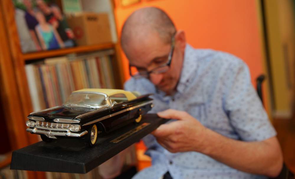 Greg Germani shows off a replica of the full-sized 1959 Chevy Impala he's owned since the 1980s. (Sean McNeil)