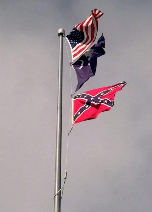 Three flags flying above the dome of the South Carolina Statehouse  in 2000, in Columbia, S.C. Lou Krasky\/AP