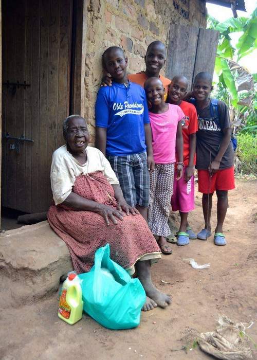 Keifah on the stoop of her home in Uganda. Contributed photo