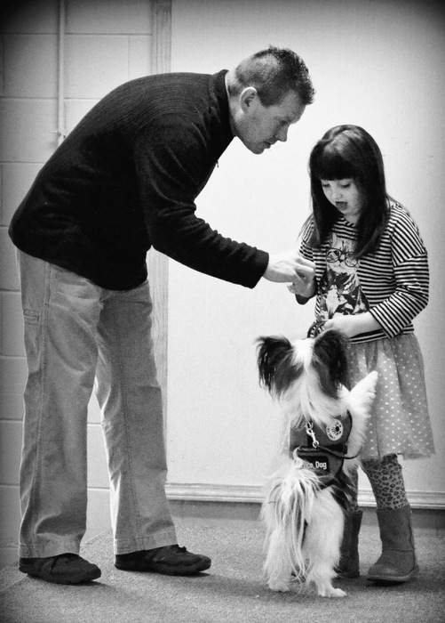 Jeremy Dulebohn, a dog trainer at 4 Paws for Ability in Xenia, Ohio, successfully matched Barkley with the Schwenker family. Contributed by HarperCollins