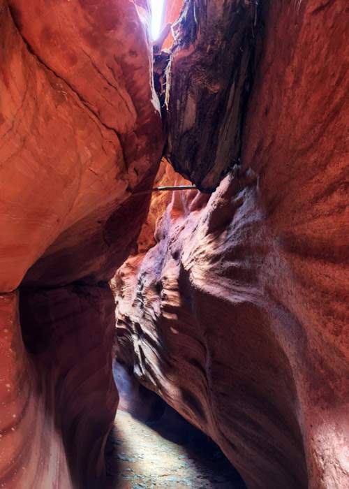 The log lodged across the top of the Peek-a-boo Canyon shows how high the water level rises during a flash flood.