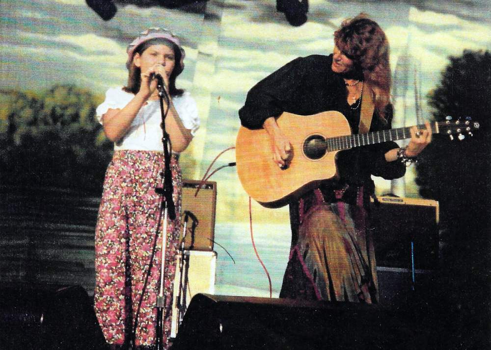 Page performs on stage with mother Caroline in 1994. Contributed photo